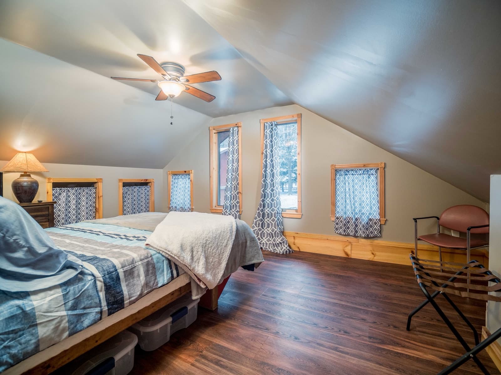 Cozy attic bedroom with warm wood floors